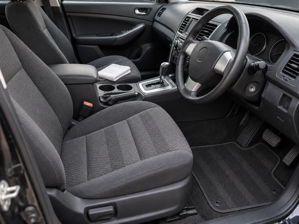 The same car interior after a full detail, clean and vacuumed